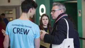 Mark Kermode and a volunteer talking at Cornwall Film Festival