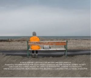 Poster for documentary Seeing the Unseen featuring the back of a woman in yellow sitting on a bench with a cloud sky