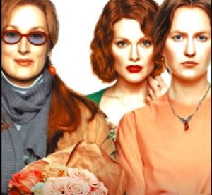 Three women (Meryl Streep, Julianne Moore and Nicole Kidman) stand together looking seriously at the camera.