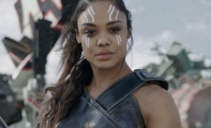 Screenshot of Valkyrie from Thor: Ragnarok. A woman standing in warrior costume and white face paint.